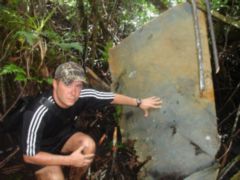 Pat Ranfranz with the tail of Lt. Zack F. Lillard's F6F-5 Hellcat that was located in July 2010